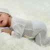 Young Baby Sleeping on Carpet