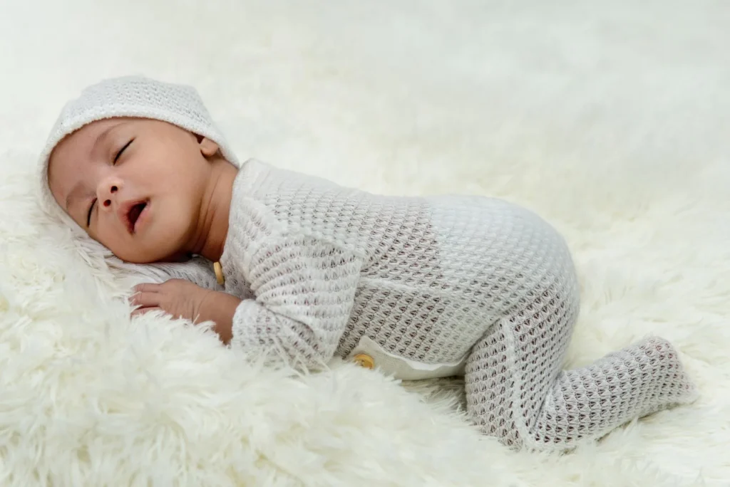 Young Baby Sleeping on Carpet
