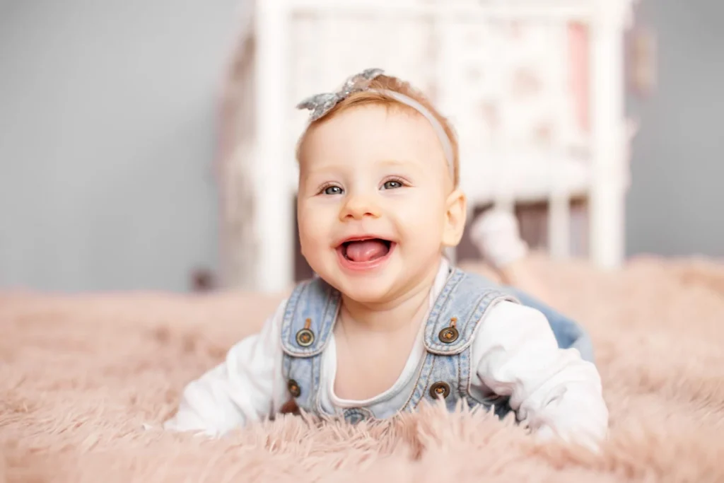 Smiling baby girl on carpet