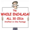 Man holding a sign that says The Whole Enchilada