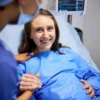 Pregnant woman smiling ready to deliver baby in hospital