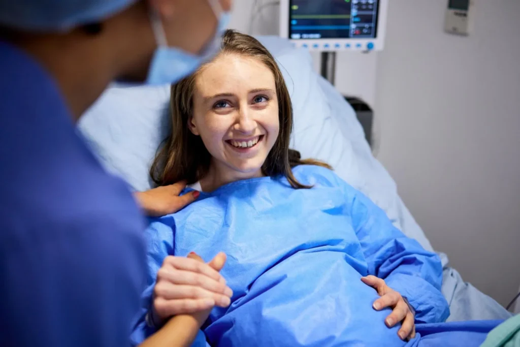 Pregnant woman smiling ready to deliver baby in hospital